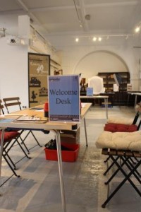Welcome desk Table w 'Welcome desk' sign